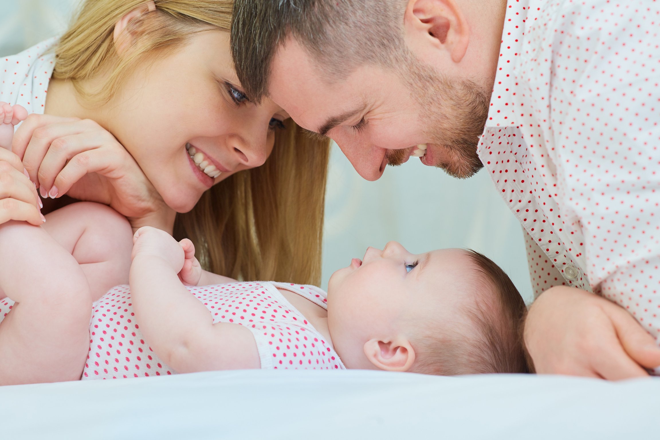 Mother Father and Baby Playing 